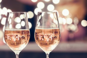 two glasses of rose wine with blurred background